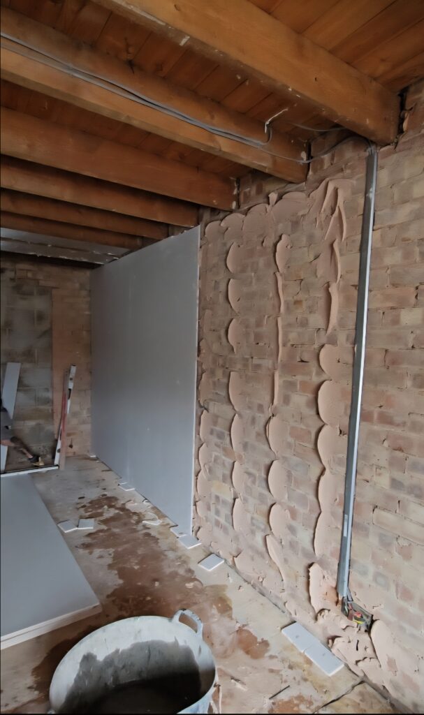 ​Dot and dab plasterboard drylining on walls and ceiling boarding installed by Renofox in a Hinckley room.
