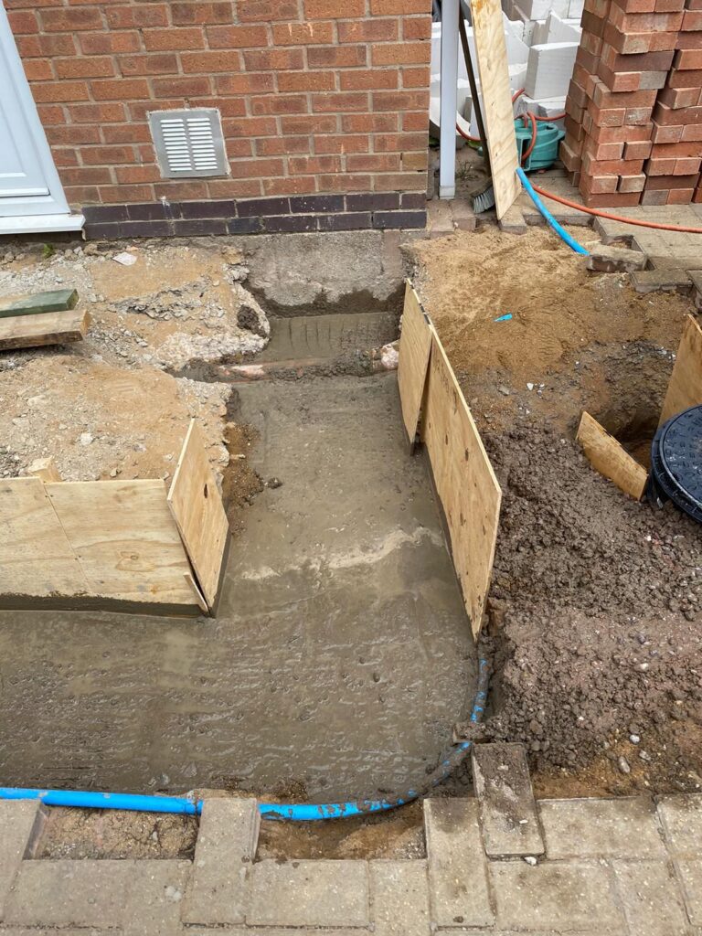 ​Poured concrete foundations and footings for a new home extension project by Renofox Construction in Hinckley.